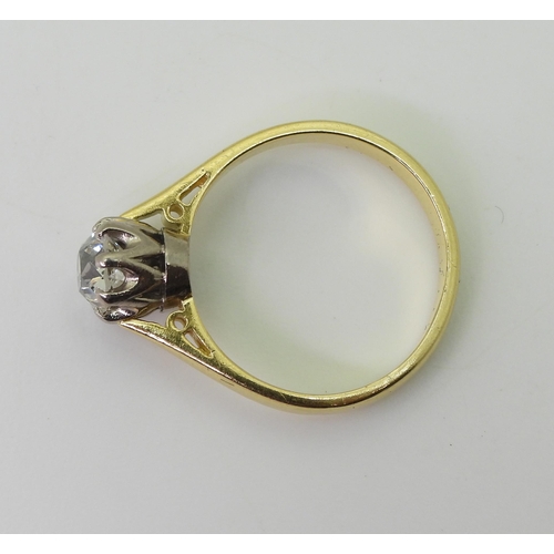 2706 - AN OLD CUT DIAMOND SOLITAIREthe 18ct yellow and white gold mount with classic crown setting, holding... 