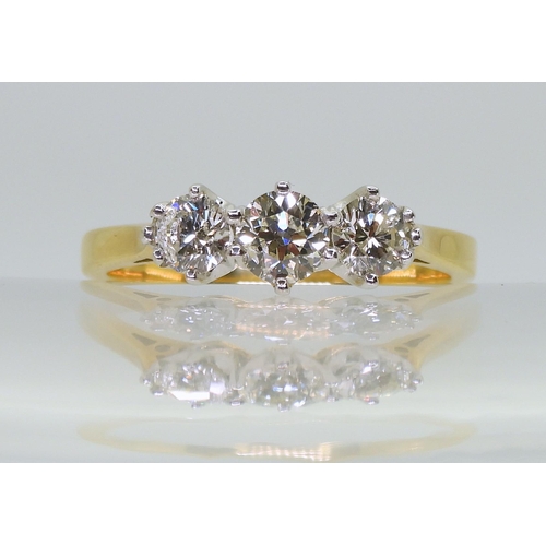 2707 - A CLASSIC THREE STONE DIAMOND RINGthe 18ct yellow and white gold mount set with estimated approx 1ct... 