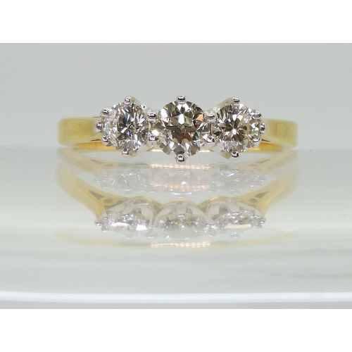 2707 - A CLASSIC THREE STONE DIAMOND RINGthe 18ct yellow and white gold mount set with estimated approx 1ct... 