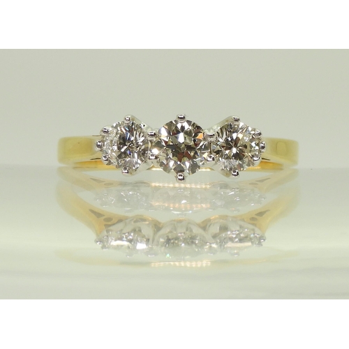 2707 - A CLASSIC THREE STONE DIAMOND RINGthe 18ct yellow and white gold mount set with estimated approx 1ct... 