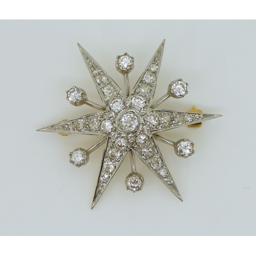 2721 - A DIAMOND STAR BROOCHmounted in 18ct yellow and white gold, set with estimated approx 1.12cts of bri... 