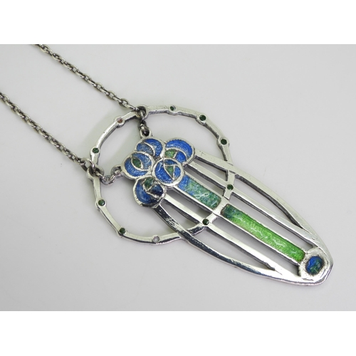 2735 - A GLASGOW GIRLS PENDANTin white metal and champlevé enamelled with Mackintosh style roses in blues a... 