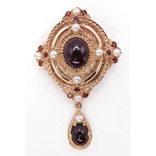 2737 - A GARNET AND PEARL PENDANT BROOCHmounted in 9ct gold, in a Renaissance style. Length of pendant with... 