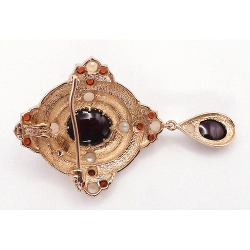 2737 - A GARNET AND PEARL PENDANT BROOCHmounted in 9ct gold, in a Renaissance style. Length of pendant with... 