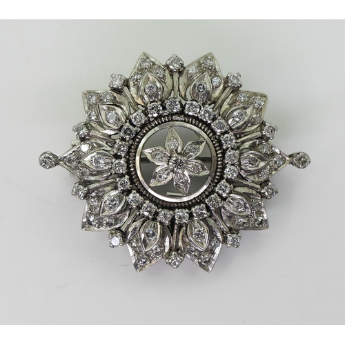 2742 - A VICTORIAN PENDANT BROOCHthe diamond flower, is set with old cut diamonds to the white metal handma... 