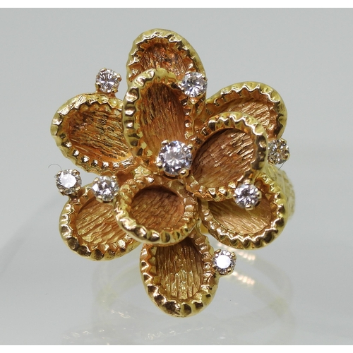 2744 - A VINTAGE STATEMENT RINGthe large multi-petal flower is made in 18ct gold with London hallmarks for ... 