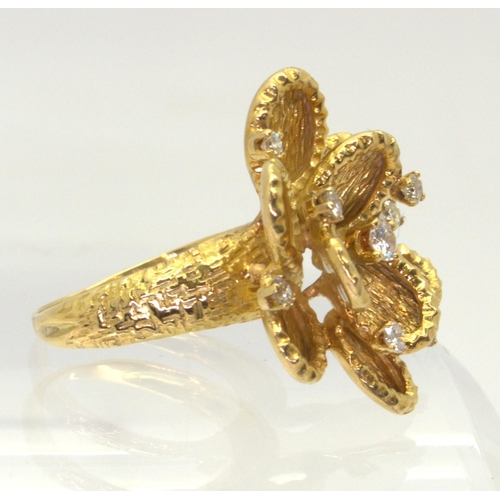 2744 - A VINTAGE STATEMENT RINGthe large multi-petal flower is made in 18ct gold with London hallmarks for ... 