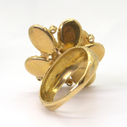 2744 - A VINTAGE STATEMENT RINGthe large multi-petal flower is made in 18ct gold with London hallmarks for ... 