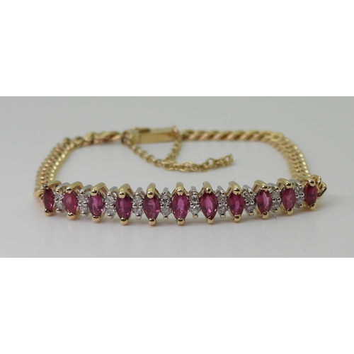 2751 - A RUBY AND DIAMOND BRACELETthe gem set panel has marquis cut rubies of approx 5mm x 2.5mm and eight ... 