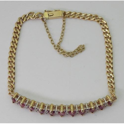 2751 - A RUBY AND DIAMOND BRACELETthe gem set panel has marquis cut rubies of approx 5mm x 2.5mm and eight ... 