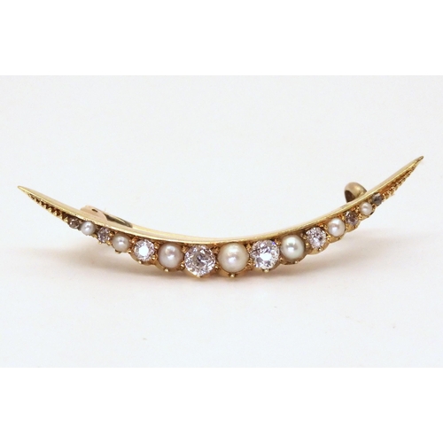 2752 - CRESCENT MOON BROOCHthe bright yellow galleried mount is set with old cut diamonds and pearls, with ... 