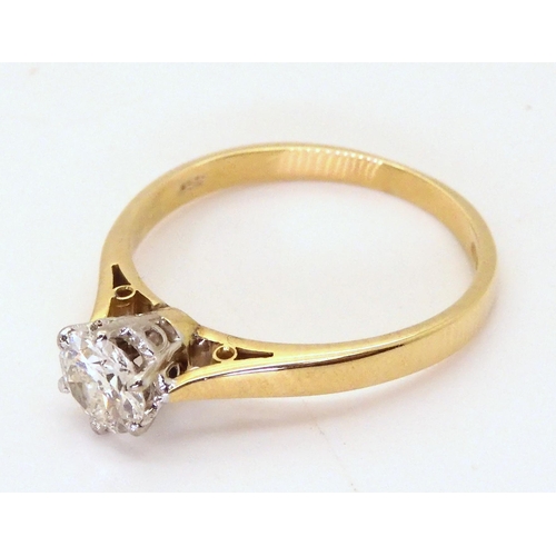 2754 - A DIAMOND SOLITAIRE RINGthe 18ct gold shank with classic crown mount is set with an estimated approx... 