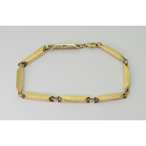 2755 - A RETRO 9CT GOLD BRACELETdesigned and made by Glasgow jeweller Eric Smith, the baton link bracelet h... 