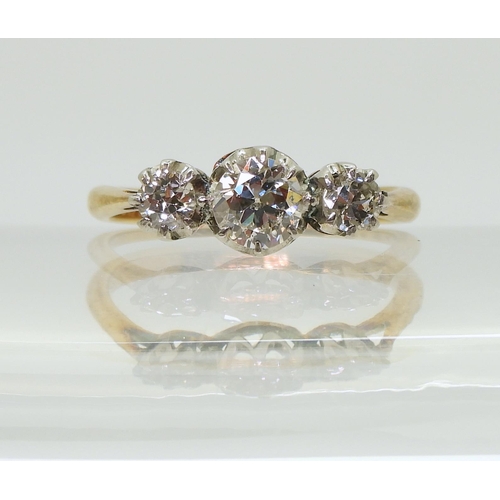 2761 - A THREE STONE DIAMOND RINGthe 18ct yellow and white gold mount is set with three old cut diamonds wi... 