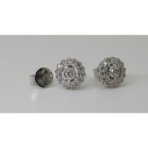 2765 - DIAMOND EARRINGS & A BRACELETthe 18ct white gold diamond cluster earrings, are set with estimate... 