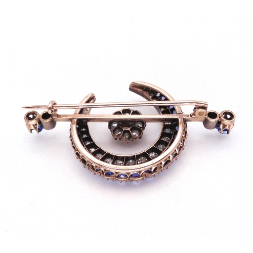 2767 - A SUBSTANTIAL CRESCENT MOON BROOCHset with diamonds a pearl and sapphires to the crescent, central f... 