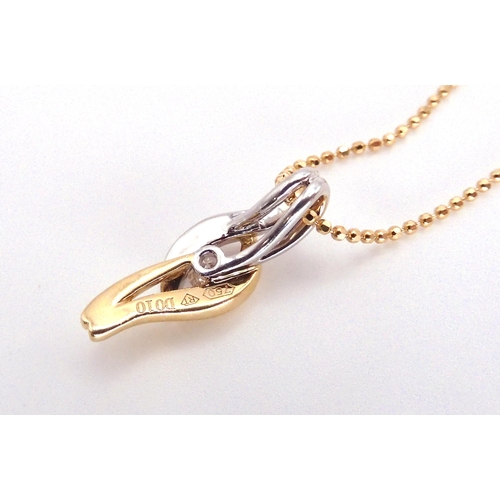 2774 - A DIAMOND PENDANTthe yellow and white 18ct gold pendant of wave form, holds a 0.10ct diamond, length... 