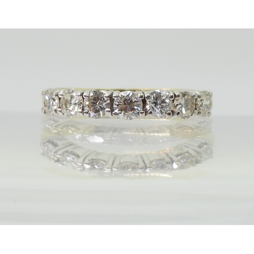 2779 - A HALF ETERNITY RINGmounted in 18ct yellow and white gold and set with estimated approx 1ct of brill... 