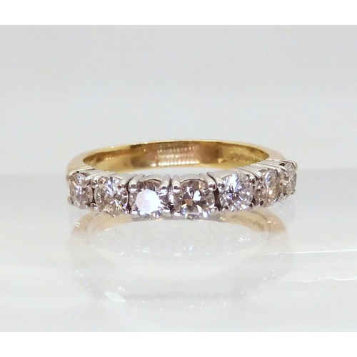 2779 - A HALF ETERNITY RINGmounted in 18ct yellow and white gold and set with estimated approx 1ct of brill... 