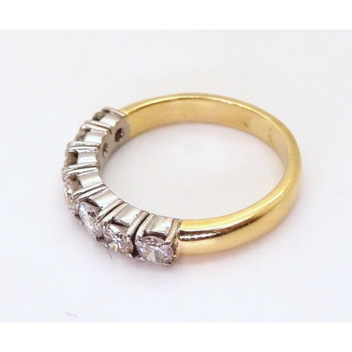 2779 - A HALF ETERNITY RINGmounted in 18ct yellow and white gold and set with estimated approx 1ct of brill... 