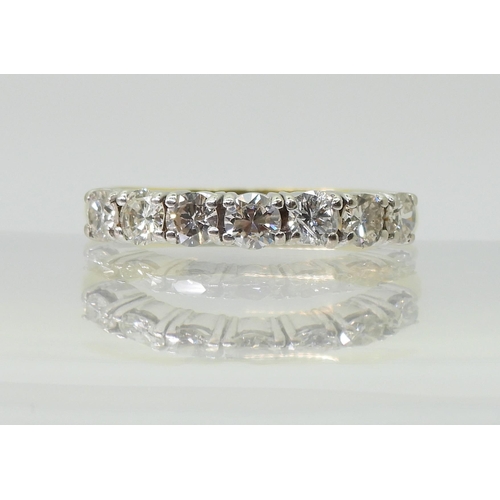 2779 - A HALF ETERNITY RINGmounted in 18ct yellow and white gold and set with estimated approx 1ct of brill... 