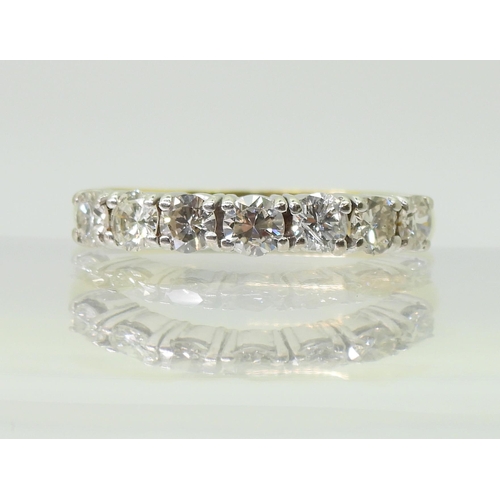 2779 - A HALF ETERNITY RINGmounted in 18ct yellow and white gold and set with estimated approx 1ct of brill... 