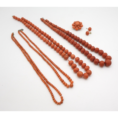 2837 - A COLLECTION OF CORAL JEWELSto include a string of faceted coral beads, the largest 14.5mm x 12.1mm,... 