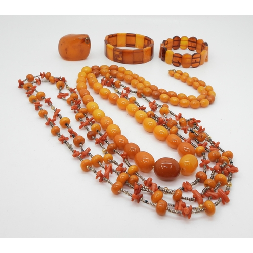 2838 - A GROUP OF AMBER COLOURED JEWELSa string of butterscotch colour beads, largest 19.3mm x 16.1mm, to s... 