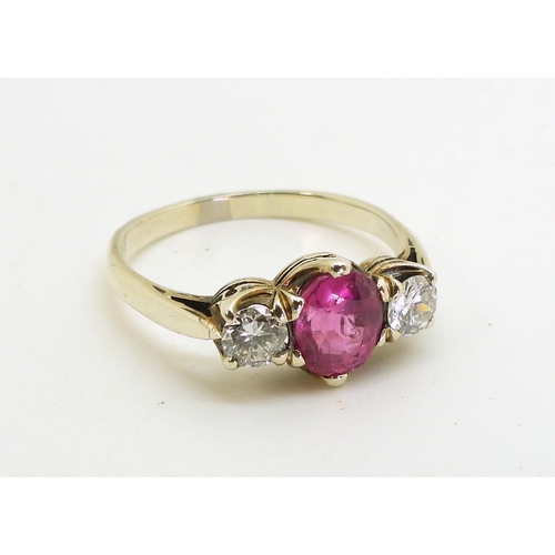 2841 - A PINK SAPPHIRE AND DIAMOND RINGmounted in white metal with decorative crown mounts, the two diamond... 