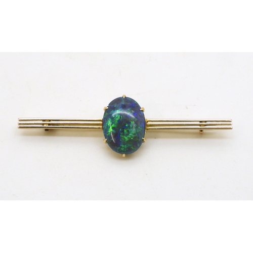 2845 - AN OPAL BROOCH BY WENDTSset in 15ct gold, the blue green oval opal with the dimensions of 14.5mm x 1... 