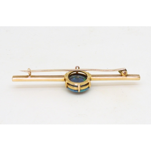 2845 - AN OPAL BROOCH BY WENDTSset in 15ct gold, the blue green oval opal with the dimensions of 14.5mm x 1... 