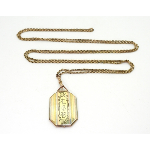 2848 - A 9CT GOLD GUARD CHAIN & LOCKETthe guard chain has attached tag stamped 9c, and stamped 9ct to t... 