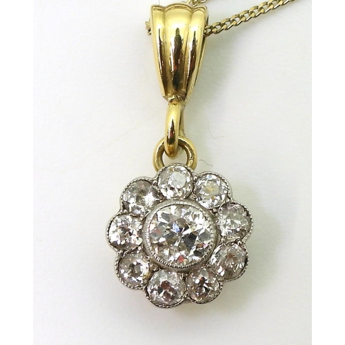 2849 - A DIAMOND FLOWER PENDANTin 14k gold mount, set with estimated approx 0.55cts of old cut diamonds, th... 