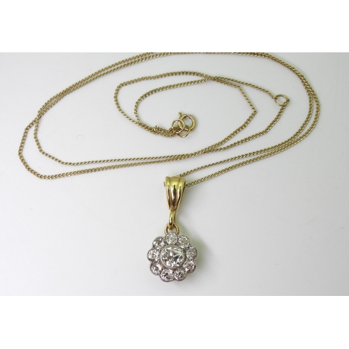 2849 - A DIAMOND FLOWER PENDANTin 14k gold mount, set with estimated approx 0.55cts of old cut diamonds, th... 