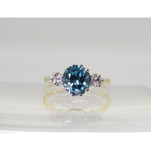 2853 - BLUE ZIRCON & DIAMOND RINGthe mount in 18ct yellow and white gold, set with a 7.6mm x 7mm x 4.6m... 