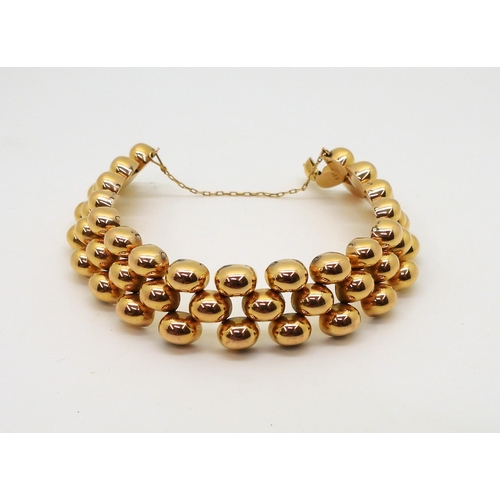 2854 - A FANCY GOLD BRACELETwith bobble pattern links and a hidden clasp, length 18.3cm, weight 43gms... 