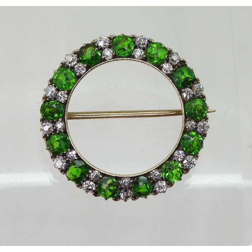 2856 - A DEMANTOID GARNET BROOCHthe thirteen demantoid garnets are each approx 3.8mm x 3.5mm x 2.5cm, inter... 