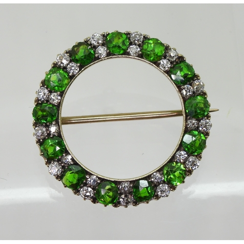 2856 - A DEMANTOID GARNET BROOCHthe thirteen demantoid garnets are each approx 3.8mm x 3.5mm x 2.5cm, inter... 