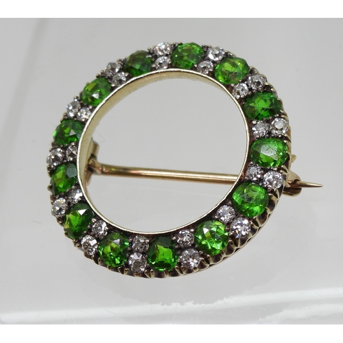 2856 - A DEMANTOID GARNET BROOCHthe thirteen demantoid garnets are each approx 3.8mm x 3.5mm x 2.5cm, inter... 