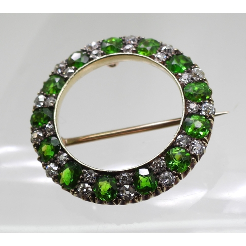 2856 - A DEMANTOID GARNET BROOCHthe thirteen demantoid garnets are each approx 3.8mm x 3.5mm x 2.5cm, inter... 