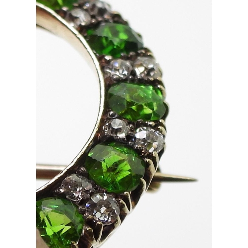 2856 - A DEMANTOID GARNET BROOCHthe thirteen demantoid garnets are each approx 3.8mm x 3.5mm x 2.5cm, inter... 