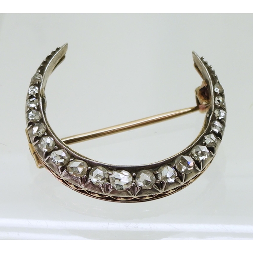 2857 - A DIAMOND CRESCENT MOONset with estimated approximately 0.20cts of rose cut diamonds to the yellow a... 