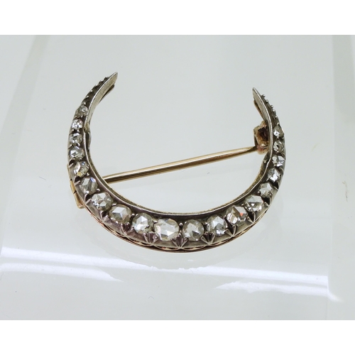 2857 - A DIAMOND CRESCENT MOONset with estimated approximately 0.20cts of rose cut diamonds to the yellow a... 