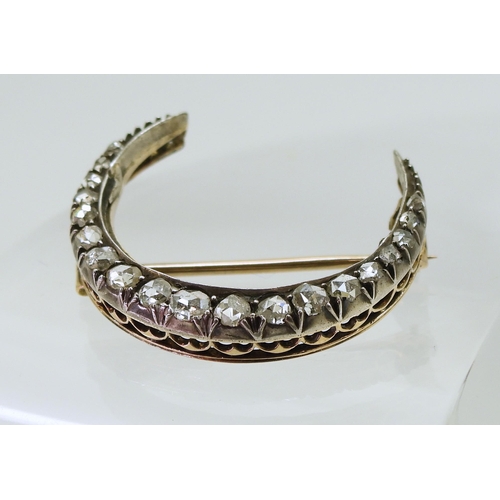 2857 - A DIAMOND CRESCENT MOONset with estimated approximately 0.20cts of rose cut diamonds to the yellow a... 