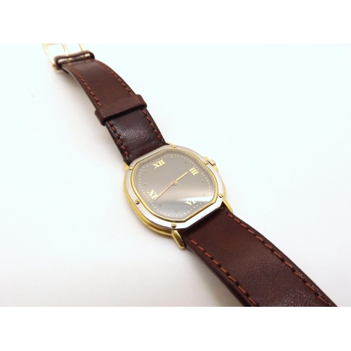 2901 - AN 18CT GOLD EBEL QUARTZ With bi colour gold case, grey dial with gold dot and Roman numerals, with ... 