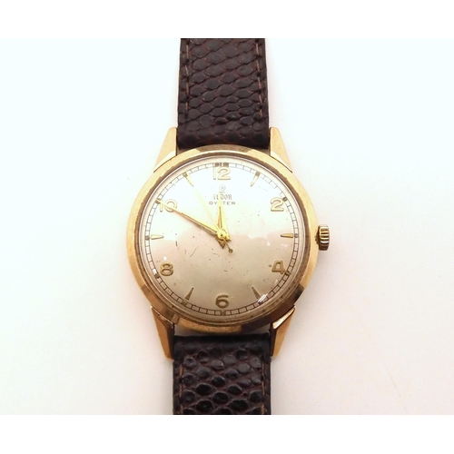 2903 - A 9CT GOLD TUDOR OYSTER WATCHwith silvered dial, Rose logo, gold coloured Arabic and baton numerals ... 