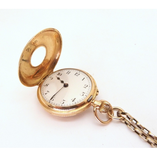 2906 - A 15CT GOLD LADIES HALF HUNTERthe fob watch has a pink and blue enamelled chapter ring, white enamel... 