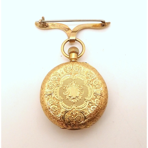 2909 - A FOB WATCH WITH BROOCHthe watch case in 18k, with decorative engraved gold dial, with black Arabic ... 