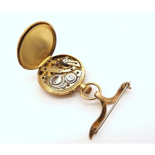 2909 - A FOB WATCH WITH BROOCHthe watch case in 18k, with decorative engraved gold dial, with black Arabic ... 