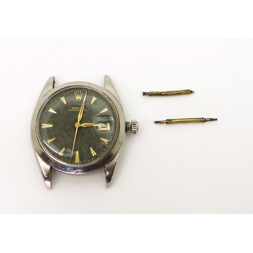 2918 - A ROLEX OYSTERDATEin stainless steel, with black dial, gold coloured chevron numeral and hands, with... 